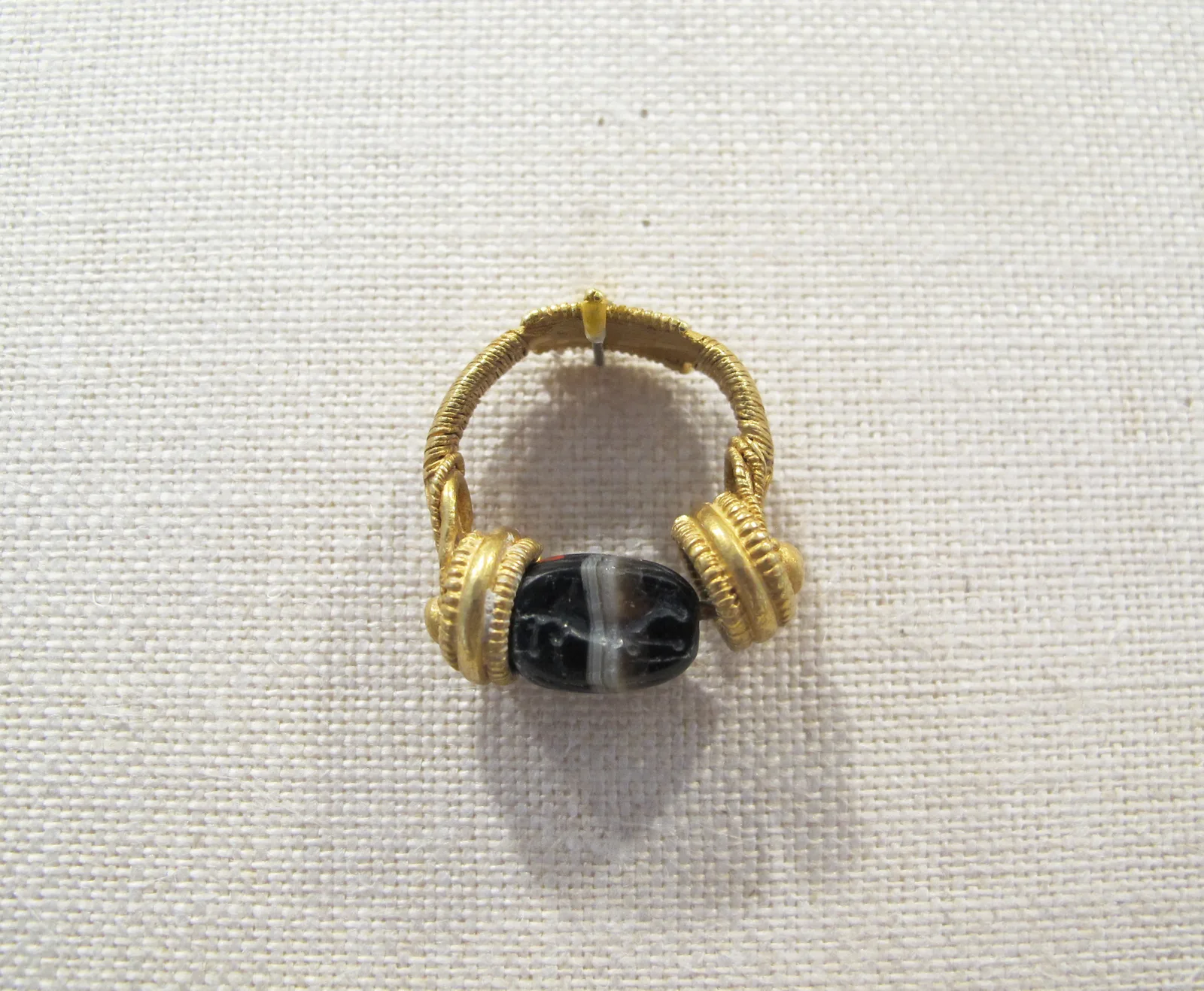 Gold swivel ring with banded agate scarab
