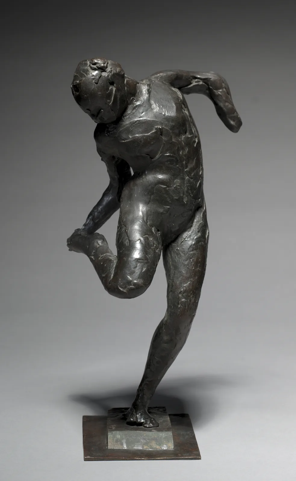 Dancer Looking at the Sole of her Right Foot