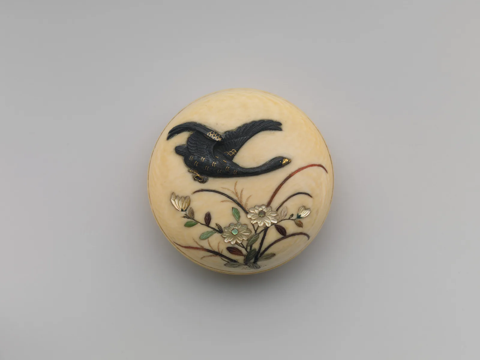 Netsuke of Flying Goose over Flowers