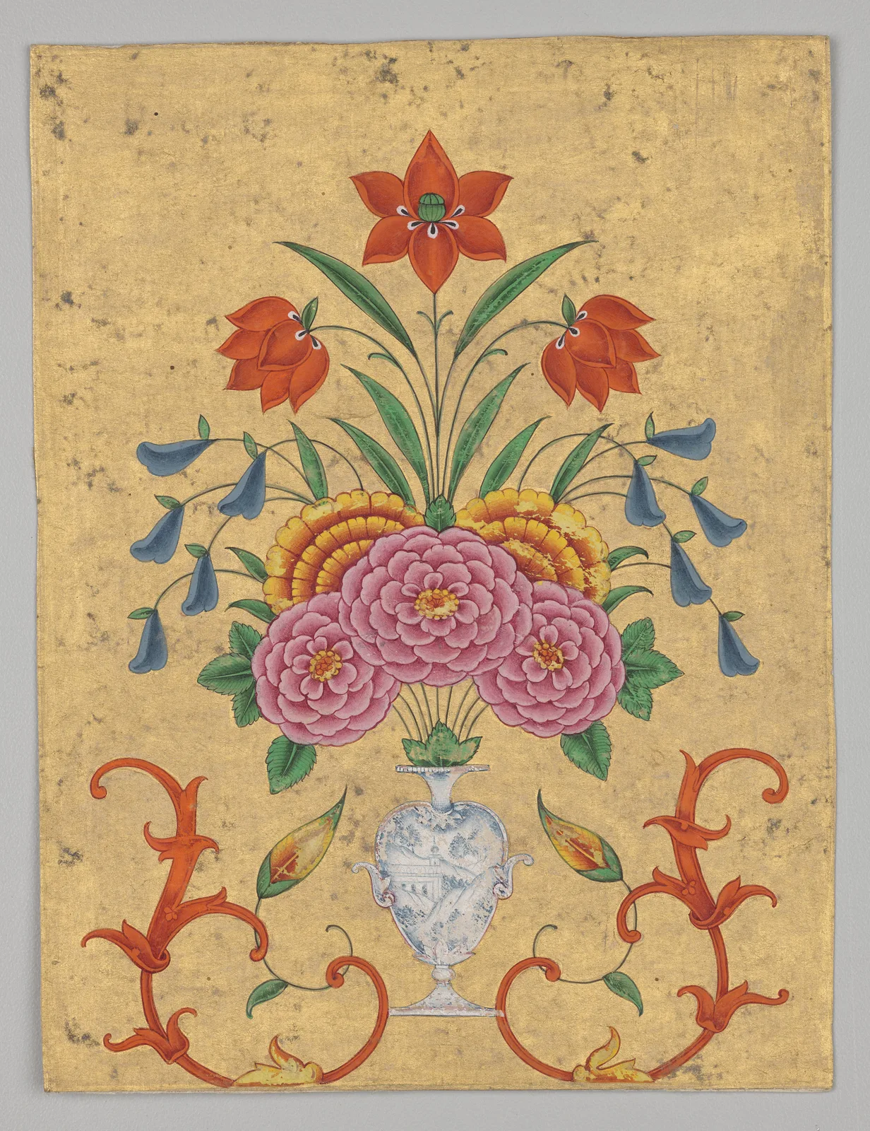 Vase with flower arrangement and scrollwork